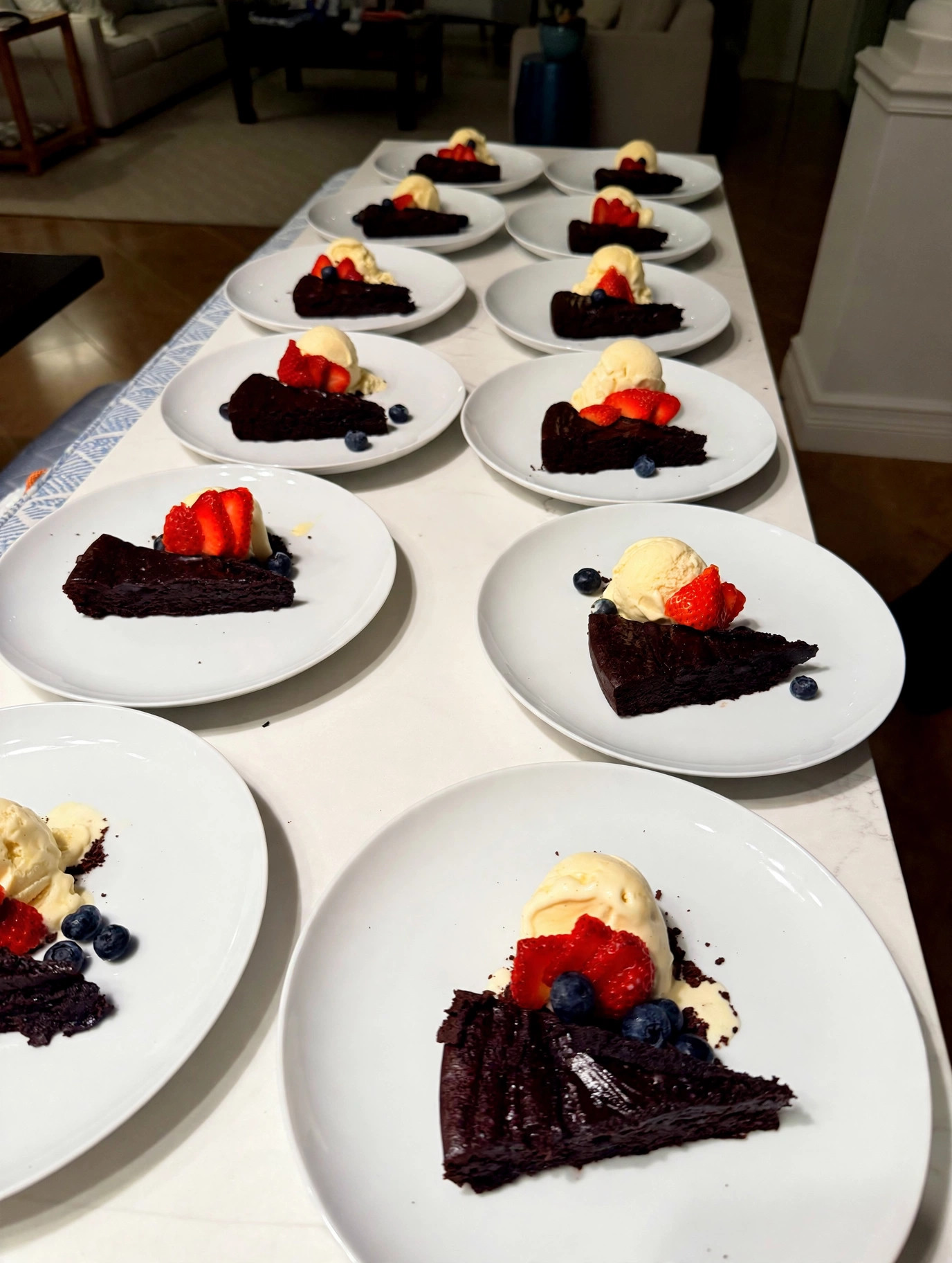 Flourless chocolate torte with vanilla ice cream and berries