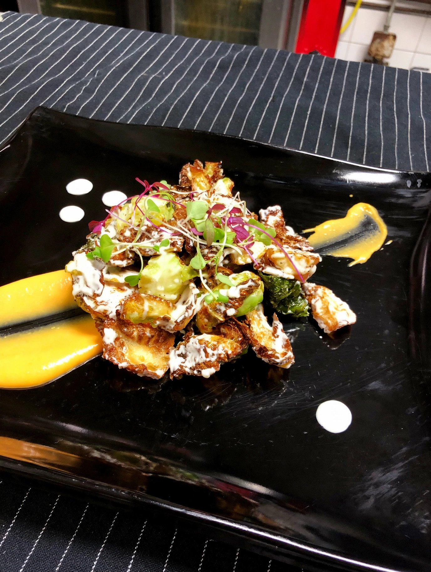 Crispy brussels sprouts with aioli and microgreens