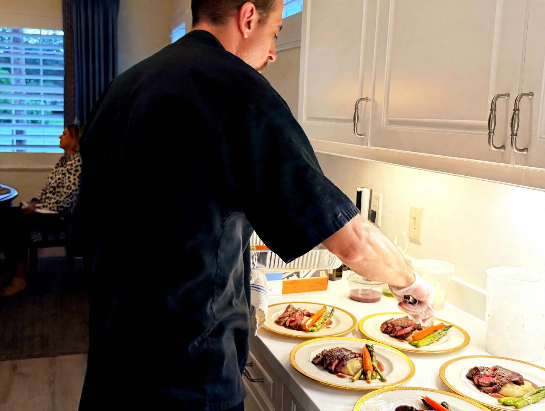 Chef Tony plating in a client's kitchen