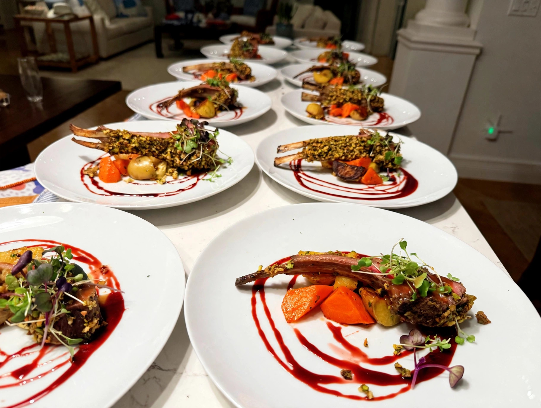 Pistachio-crusted rack of lamb, plated for a dinner party