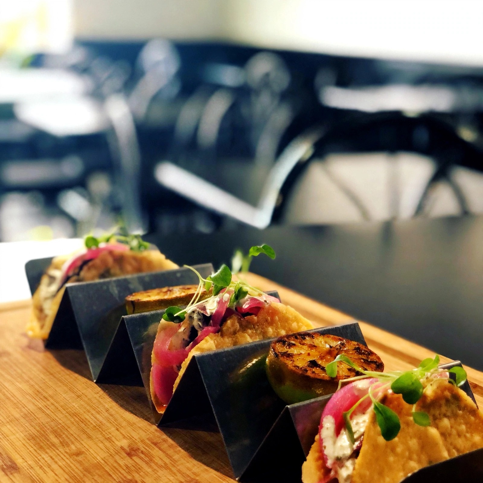 Street tacos with pickled onions and microgreens